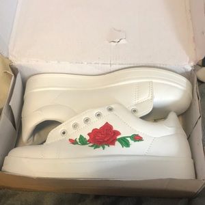 white sneakers with rose